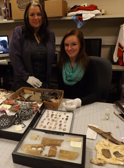 Dr. Rhonda Dass and student Stephanie Dixon with items from Erma Erikson's collection..