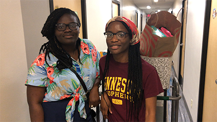 Transfer student Faith Adebayo and her cousin Ike Ojo, a Minnesota State alum, moved Ike into her McElroy room. 